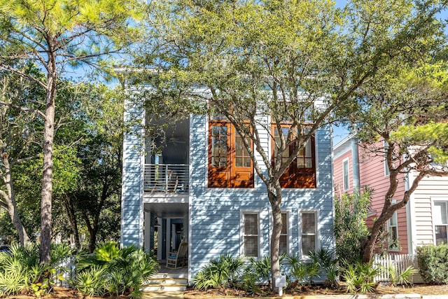 view of front of home with a balcony