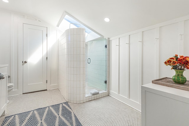 full bath featuring recessed lighting, toilet, vaulted ceiling, a shower stall, and tile patterned floors