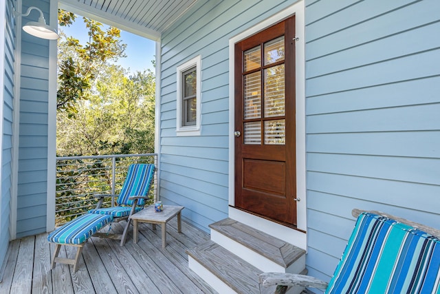 view of exterior entry featuring a porch