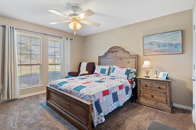 bedroom featuring carpet, baseboards, ceiling fan, and a textured ceiling