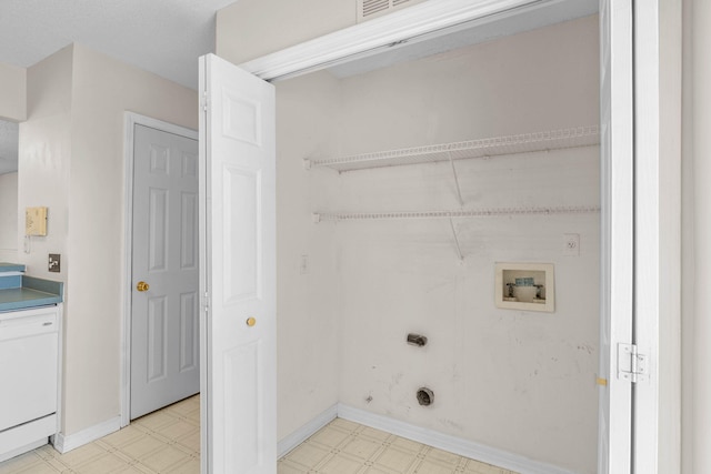 washroom with washer hookup, laundry area, baseboards, and light floors