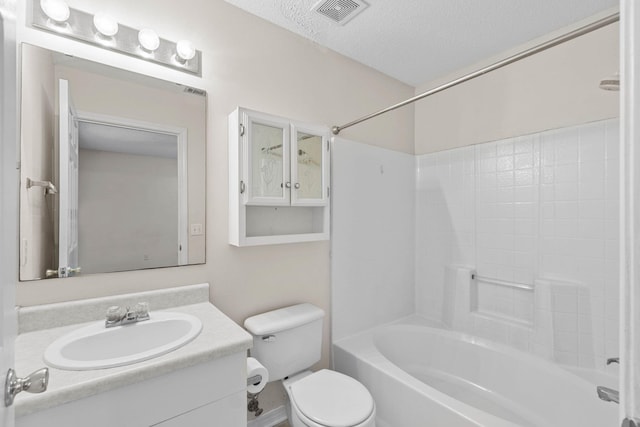 bathroom with shower / washtub combination, visible vents, toilet, a textured ceiling, and vanity