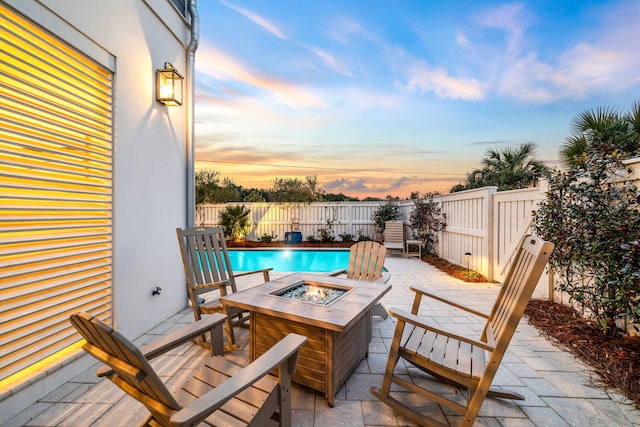 exterior space with fence private yard, an outdoor fire pit, and a patio