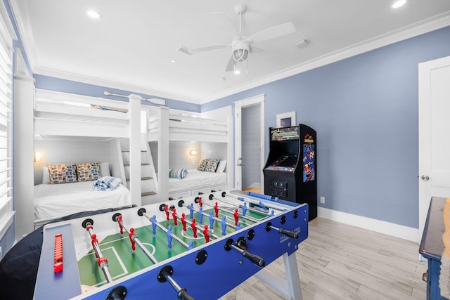 playroom featuring baseboards, ceiling fan, ornamental molding, wood finished floors, and recessed lighting