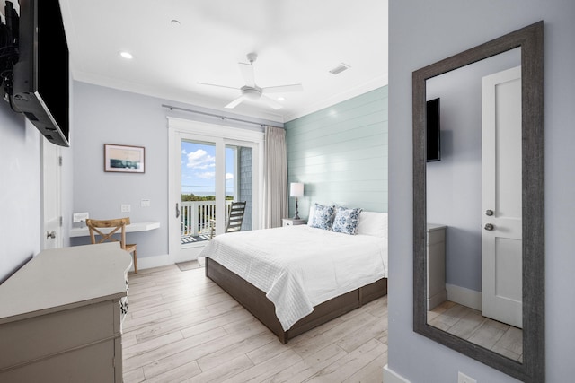 bedroom featuring access to exterior, light wood-style flooring, and ornamental molding