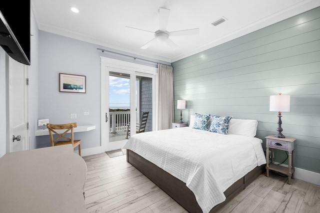 bedroom featuring light wood-type flooring, access to outside, crown molding, and baseboards