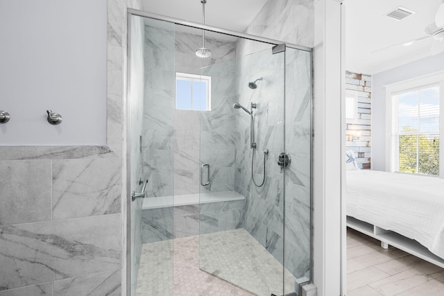 bathroom featuring a marble finish shower, visible vents, wood finished floors, and ensuite bathroom