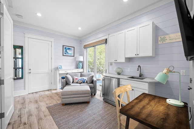 office with recessed lighting, a sink, and light wood-style floors