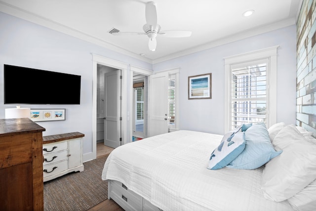 bedroom with ceiling fan, ornamental molding, visible vents, and baseboards