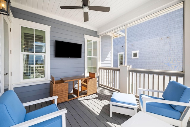 wooden terrace featuring ceiling fan