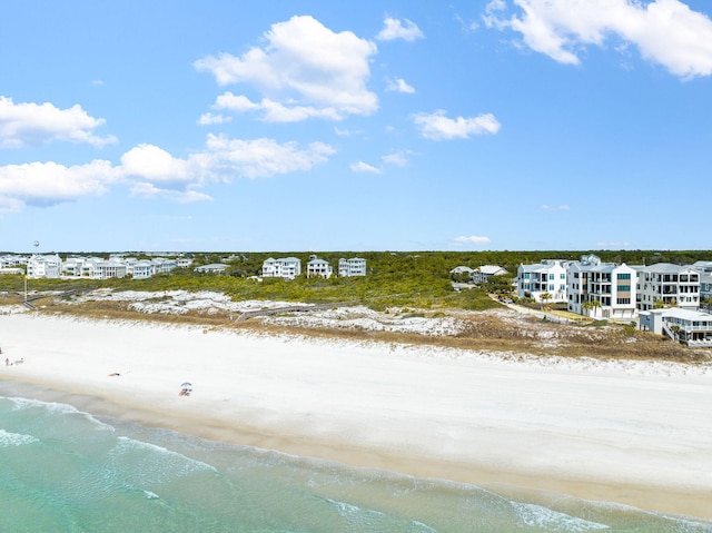 birds eye view of property with a view of the beach and a water view