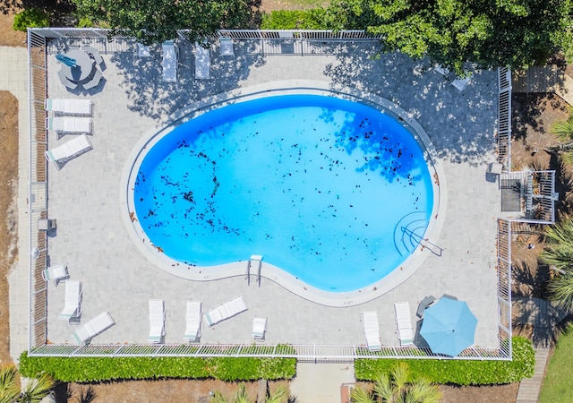 view of swimming pool with fence