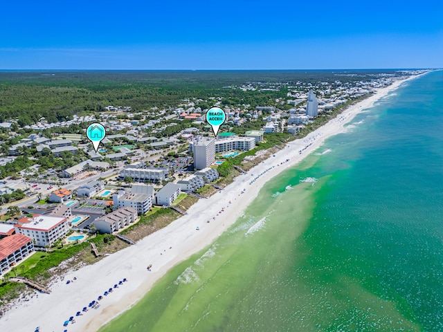 aerial view with a water view and a view of the beach