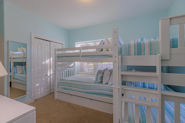 carpeted bedroom featuring a closet