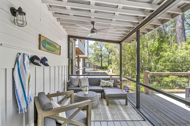 sunroom featuring ceiling fan