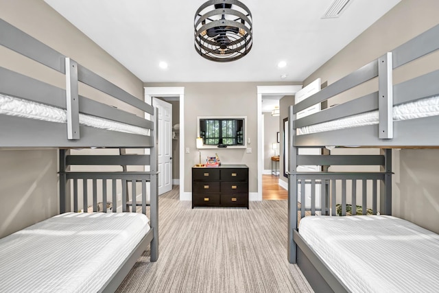 bedroom featuring carpet floors, recessed lighting, visible vents, and baseboards