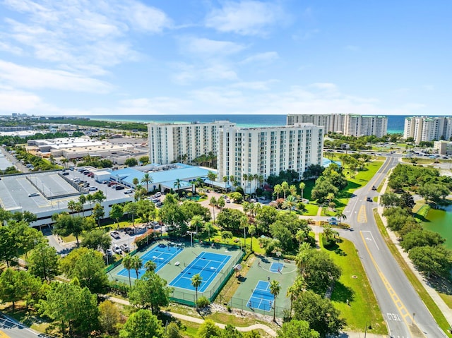 birds eye view of property featuring a view of city and a water view