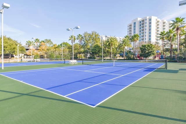 view of tennis court with fence