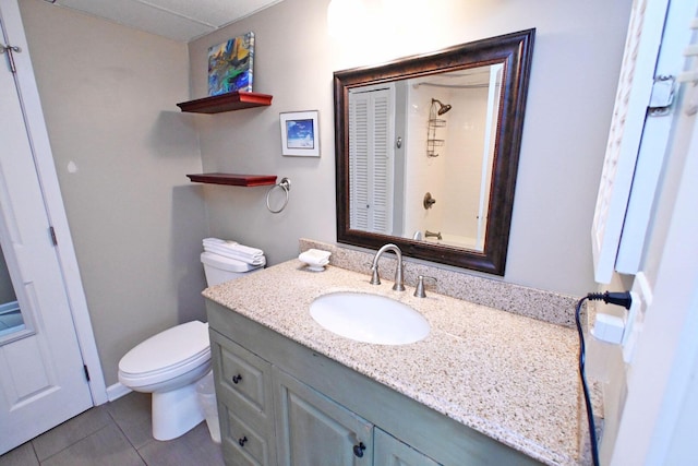 full bath with vanity, toilet, and tile patterned floors