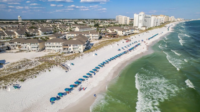 bird's eye view with a view of the beach, a water view, and a city view