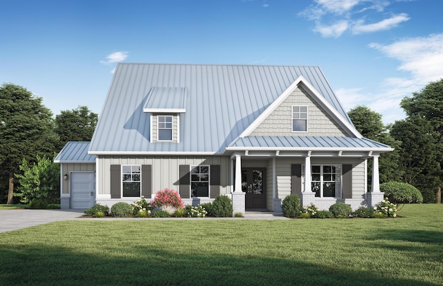 view of front of house with a front lawn, an attached garage, a standing seam roof, and metal roof