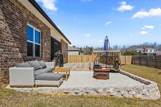 view of yard featuring a fenced backyard, a wooden deck, and an outdoor hangout area