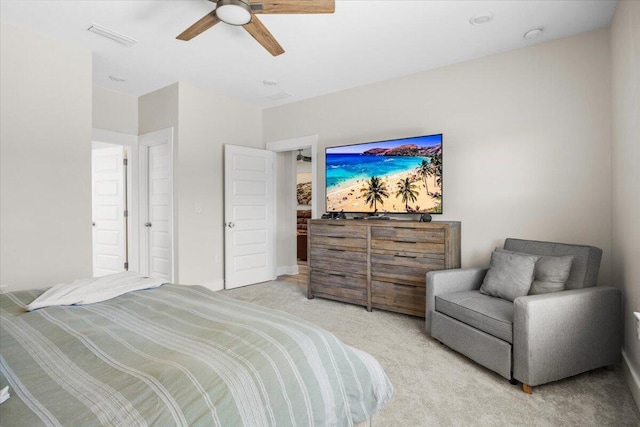 bedroom featuring light carpet, ceiling fan, and visible vents