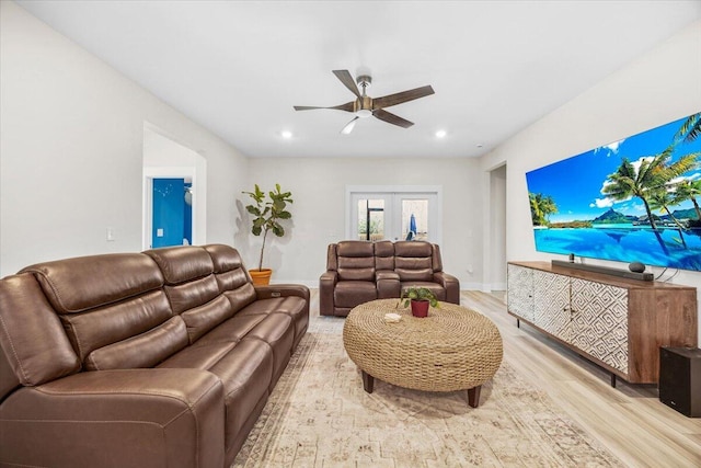 living room featuring recessed lighting, ceiling fan, baseboards, and wood finished floors