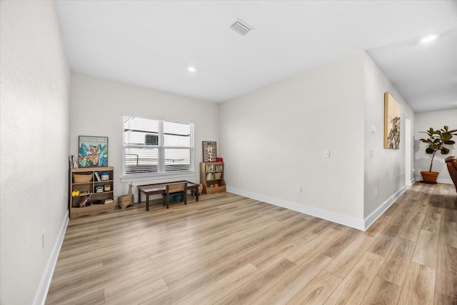 interior space featuring recessed lighting, light wood-type flooring, visible vents, and baseboards