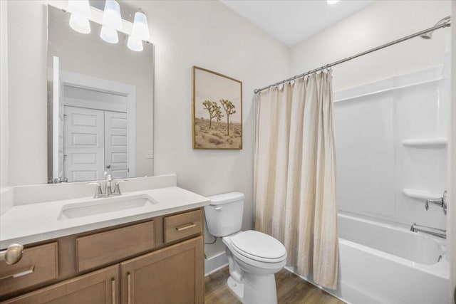 full bathroom with wood finished floors, vanity, toilet, and shower / bathtub combination with curtain