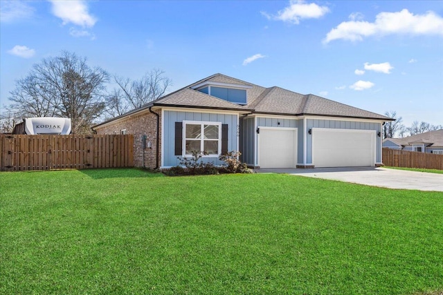 view of front of home with a garage, a front yard, fence, and driveway