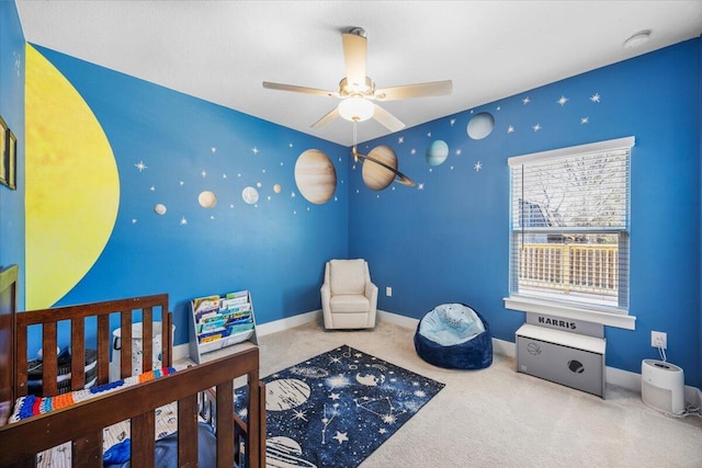 bedroom with carpet, baseboards, and a ceiling fan