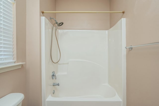 full bathroom with shower / bathing tub combination and toilet