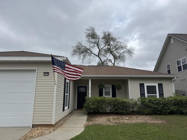 202 Ladue Ave, Crestview, FL 32539 - view of front of house with a garage and a front lawn