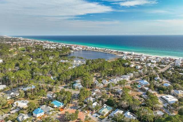 aerial view with a water view and a view of the beach