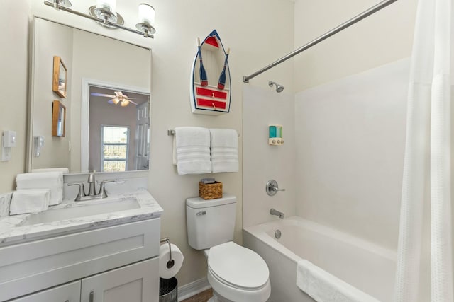 bathroom featuring shower / bath combo, vanity, toilet, and a ceiling fan