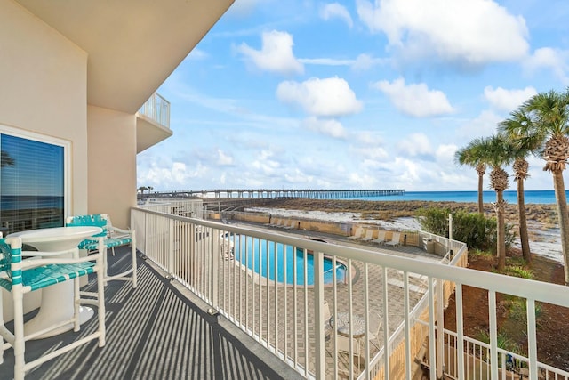 balcony featuring a water view