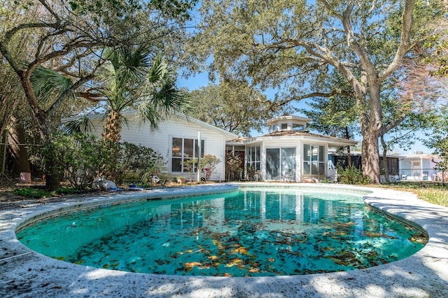 pool with a sunroom