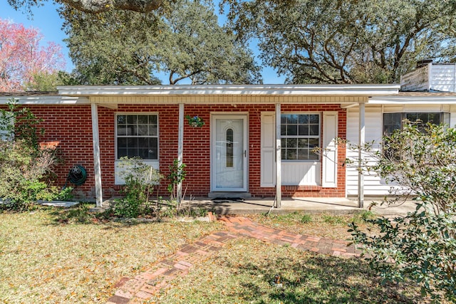 view of front of house with brick siding