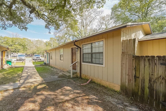 view of side of property featuring entry steps