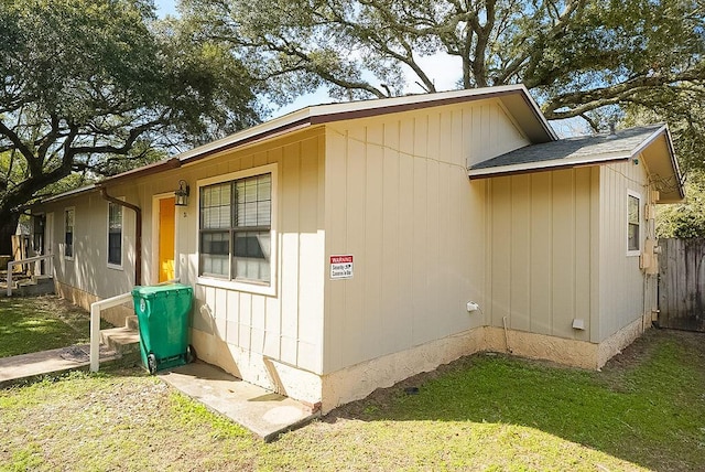 view of property exterior with a yard