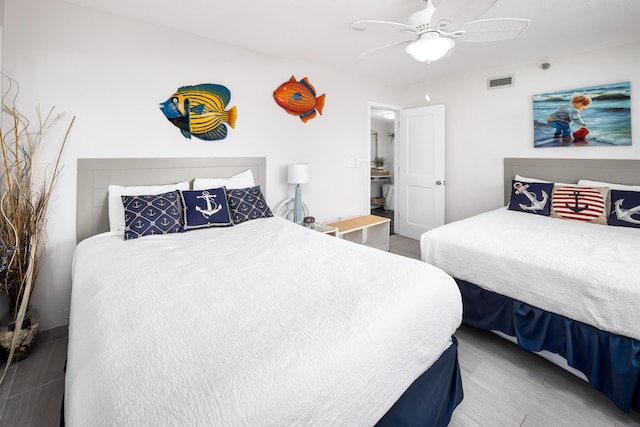 bedroom with ceiling fan and visible vents