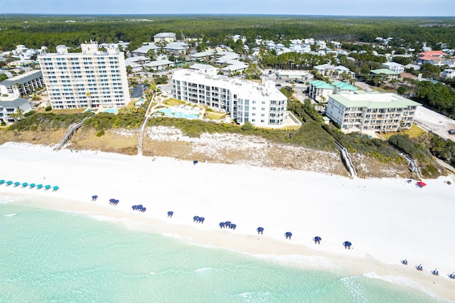 drone / aerial view featuring a water view and a beach view