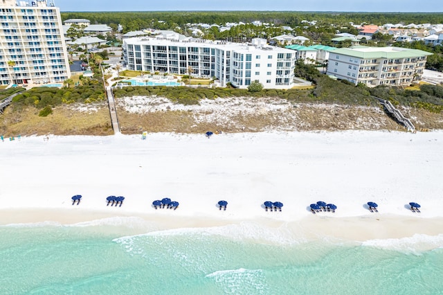 aerial view featuring a view of the beach and a water view