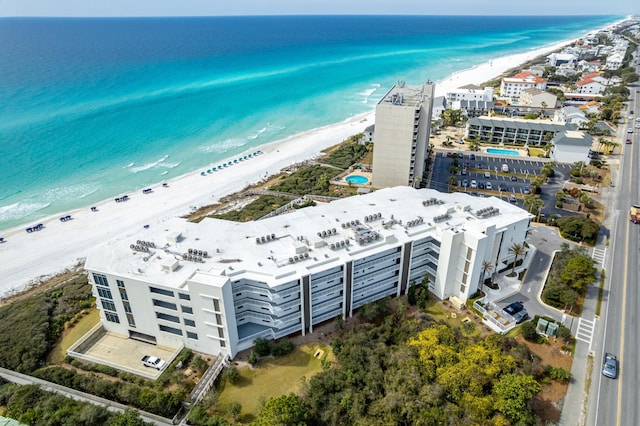 drone / aerial view featuring a view of the beach and a water view