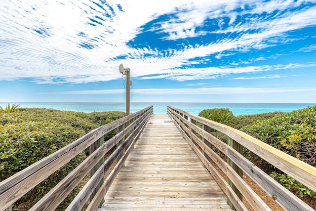 view of community with a view of the beach and a water view