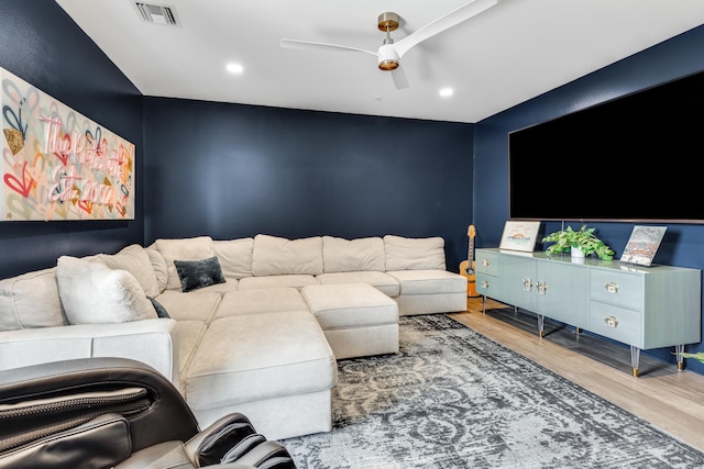 living area featuring a ceiling fan, recessed lighting, visible vents, and wood finished floors