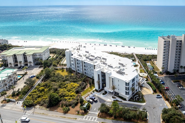 bird's eye view featuring a water view and a view of the beach