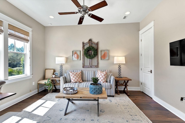 living room with wood finished floors, recessed lighting, baseboards, and visible vents