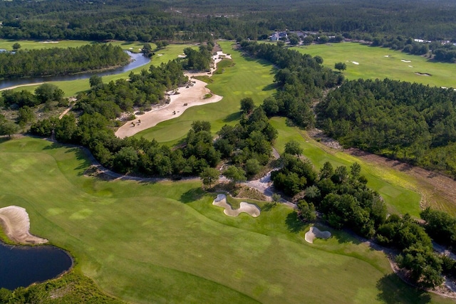 birds eye view of property featuring a water view and view of golf course